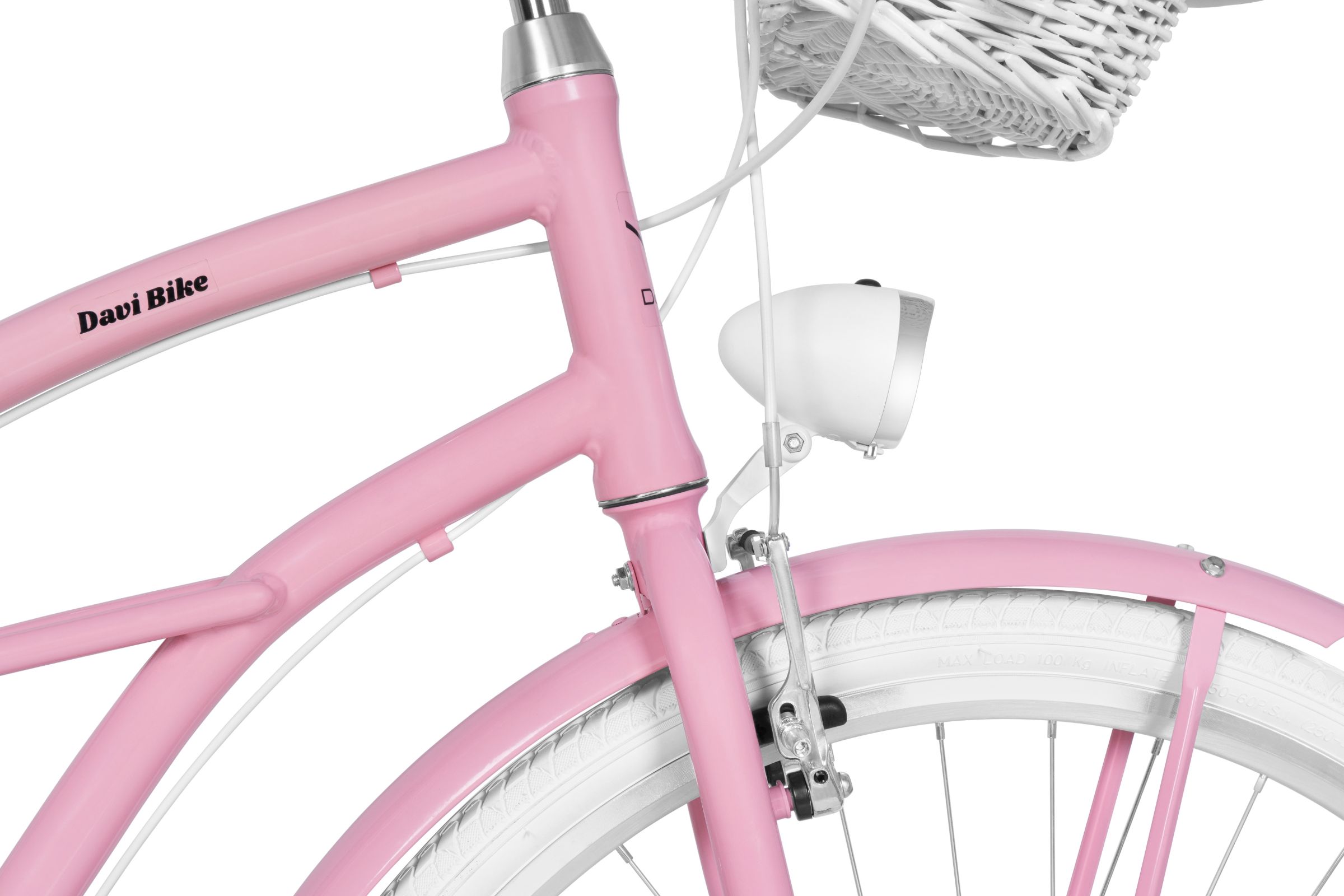 Lyserød cykel med kurv og lygte detalje